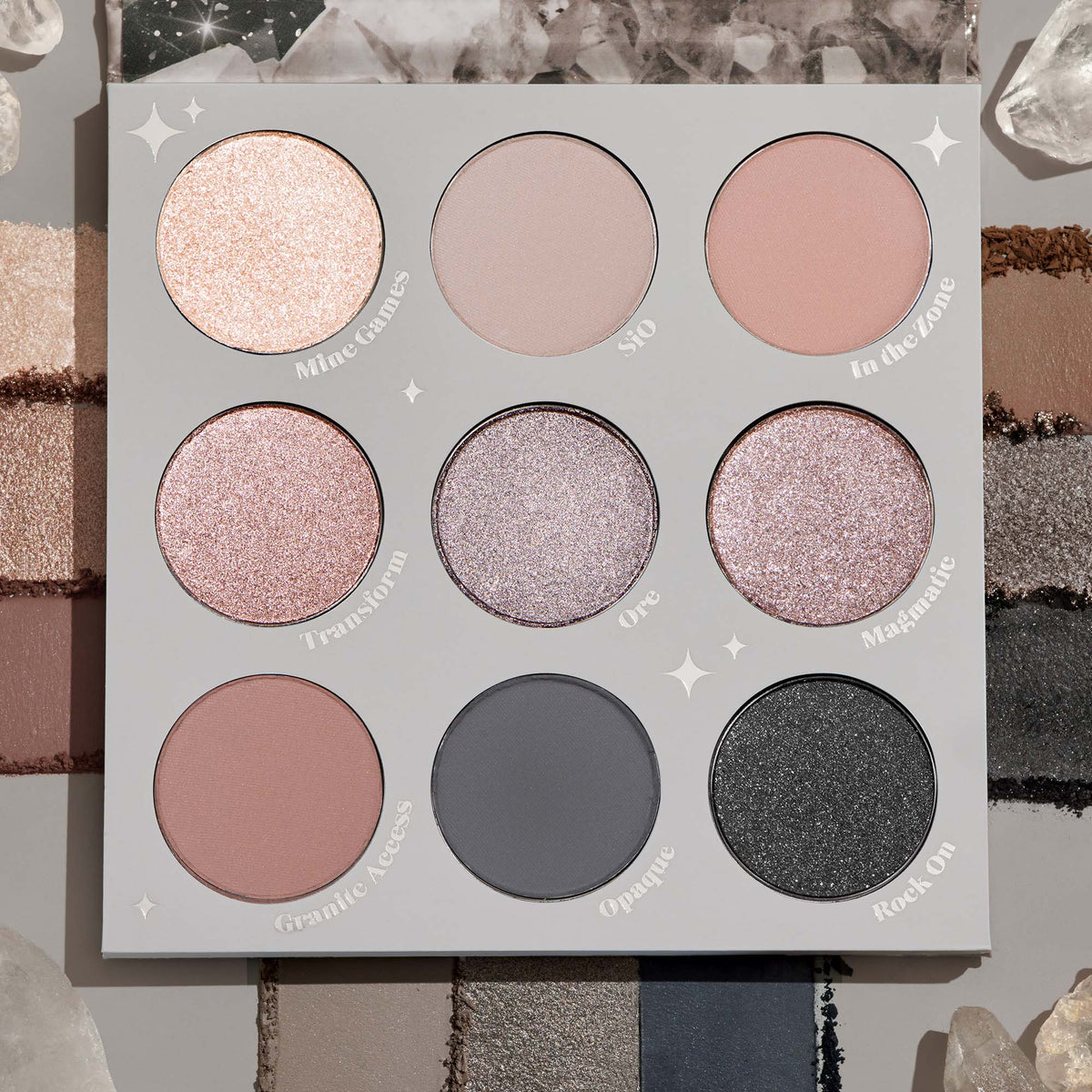 ColourPop Of Quartz shadow palette displays nine cool-toned shades - champagne, taupe, rose, mauve, pewter, matte gray, and glittery charcoal - in a 3x3 layout within a light gray case, surrounded by quartz crystals and swatch strips.