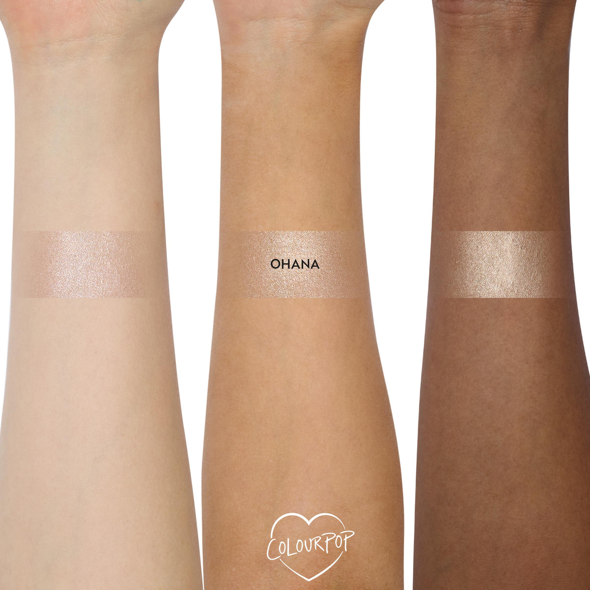 ColourPop Super Shock Highlighter in Ohana swatched in wide stripes on three forearms (light, medium, deep), revealing a pink champagne shimmer with smooth, high-shine payoff; center swatch labeled OHANA on a clean white studio background.