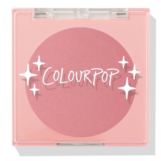 Sassy Pants ColourPop Pressed Powder Blush compact showcasing a rosy matte pan, closed with a clear lid and white star accents over the logo, set in a square light-pink plastic case on a clean white background.