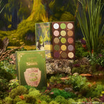 ColourPop Shadow Palette Beware Ogre opens to display 15 earthy green, brown, and gold mattes and shimmers, paired with a matching green box and Shrek artwork, styled in a mossy swamp setting.
