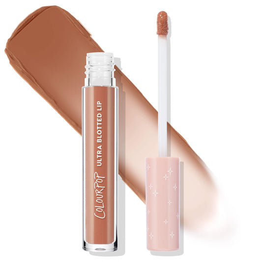 Starling Ultra Blotted Lip by ColourPop standing uncapped, showing a doe-foot applicator and a wide swipe of warm nude-brown soft‑matte color behind, in a clear tube with white logo and pink star-print cap; ColourPop Ultra Blotted Lip.