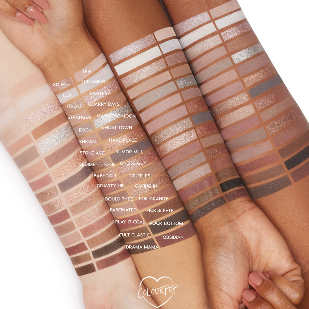 Stone Cold Fox ColourPop Shadow Palette swatches in cool neutrals - ivory, taupe, greige, mauve, silver, charcoal - displayed in neat rows across three arms of light, medium, and deep skin, with labeled shades highlighting matte and shimmer payoff.