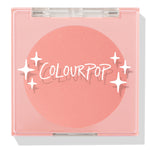 Swirled ColourPop Pressed Powder Blush compact closed, showcasing a warm peach‑coral matte pan beneath a clear pink lid with white starburst logo, square plastic case centered on a white background.