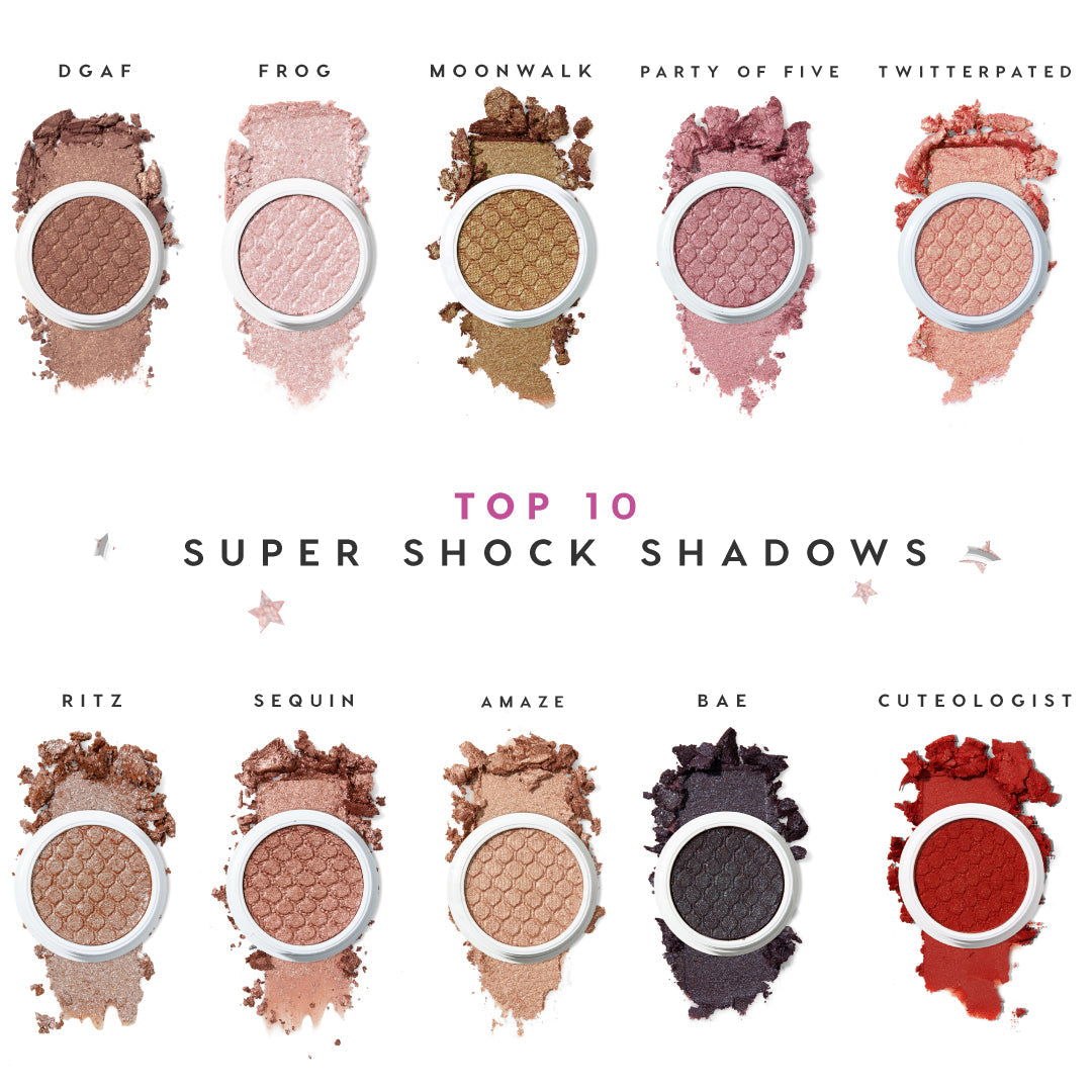ColourPop Super Shock Shadow Ritz swatched - an ultra-sparkly champagne taupe eyeshadow in a round pot with honeycomb embossing, pigment smeared around the pan - shown on a white background as part of the Top 10 Super Shock Shadows lineup.