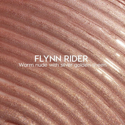 Flynn Rider Ultra Glossy Lip swatch shows a warm nude gloss with silver‑gold shimmer, spread in wavy ripples for a high‑shine finish; close-up of the ColourPop Ultra Glossy Lip shade on a textured smear.