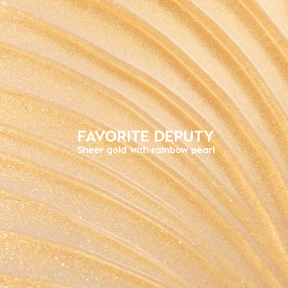 ColourPop Ultra Glossy Lip Favorite Deputy swatch sparkles in sheer gold with rainbow pearl; curved streaks fan across a glossy surface, showcasing a high-shine micro-glitter finish and lightweight, non-opaque coverage.