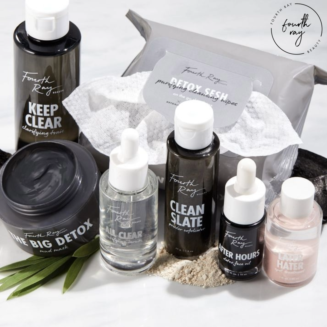 All Clear Purifying Serum face serum by Fourth Ray Beauty in a clear glass dropper bottle stands centered among Clean Slate exfoliator, Keep Clear tonic, Detox Sesh wipes, and a clay mask on white marble - a ColourPop Face Serum.