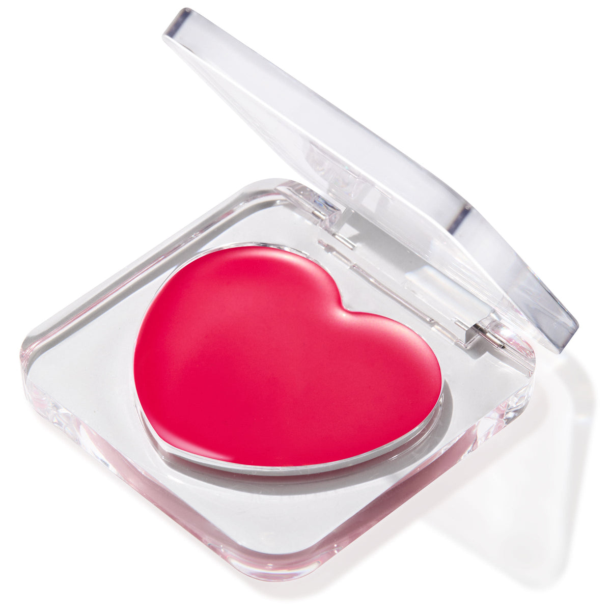 Heart-shaped hot pink Girls Night ColourPop Lip and Cheek Balm rests in a clear acrylic compact with the lid half open, showing a glossy cream tint at an angle on a bright white background.